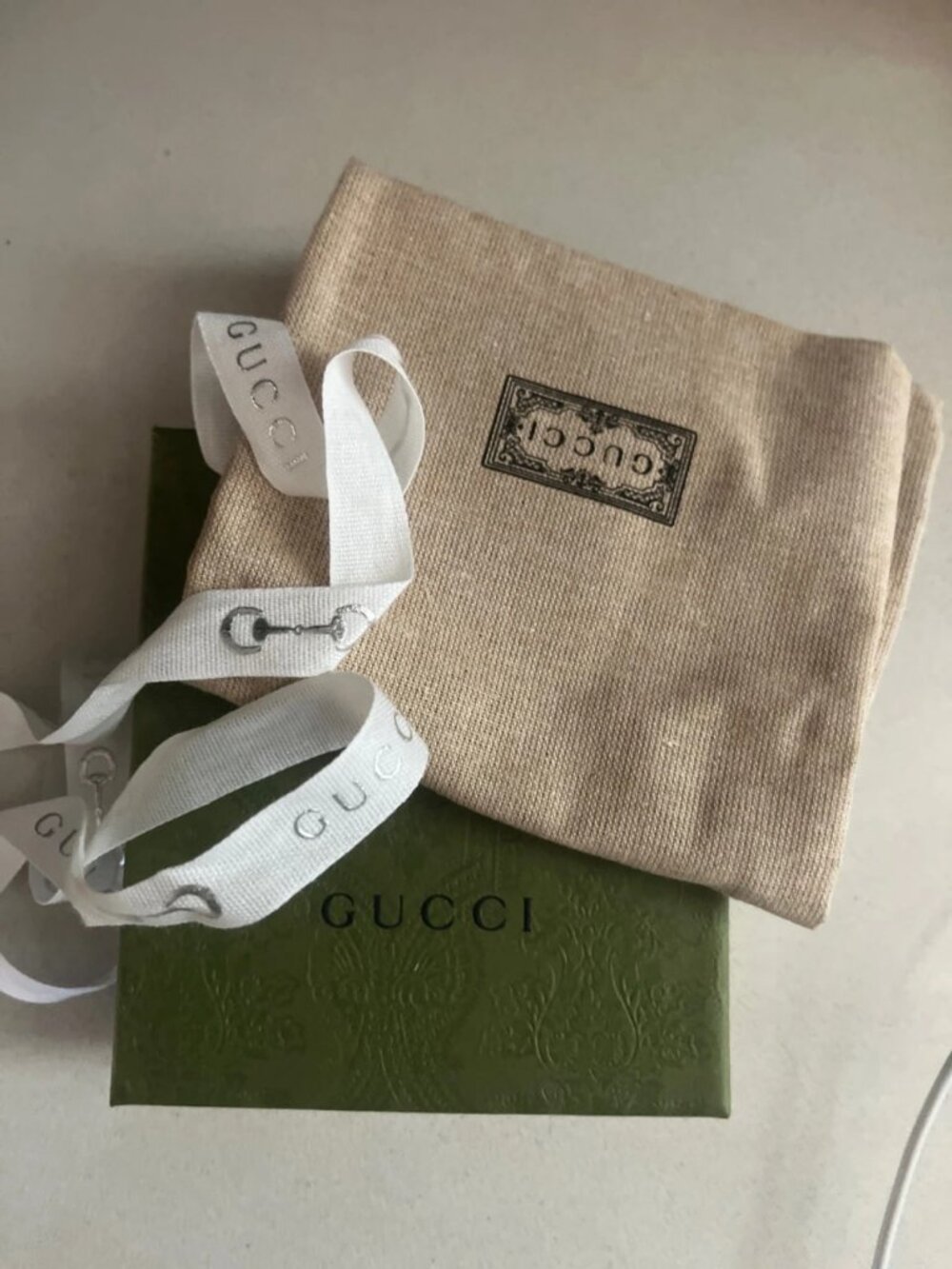 A luxurious gift set in a green box with a matching storage pouch